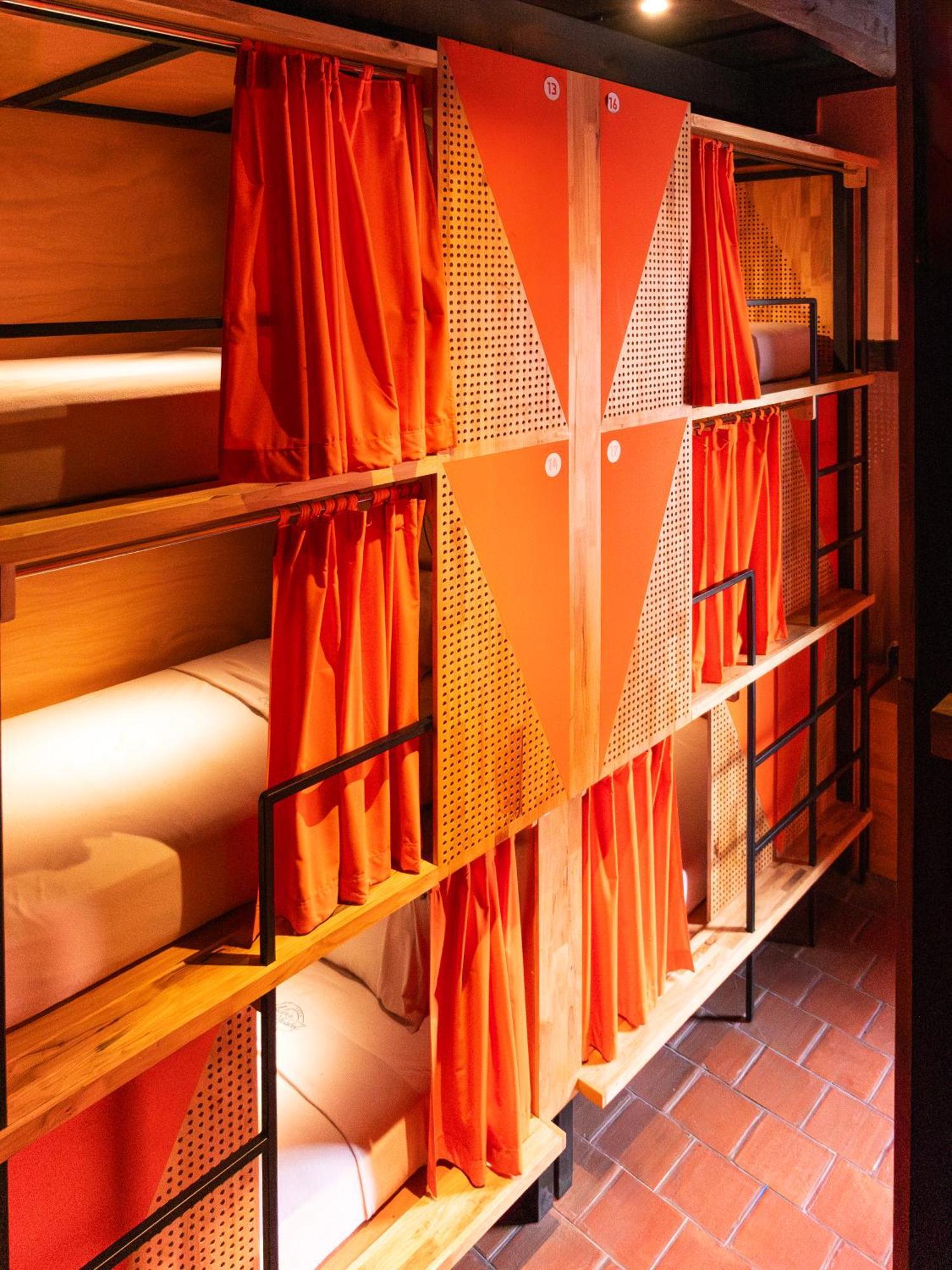 Adra Hostel Antigua Exterior foto Curtains in a capsule hotel